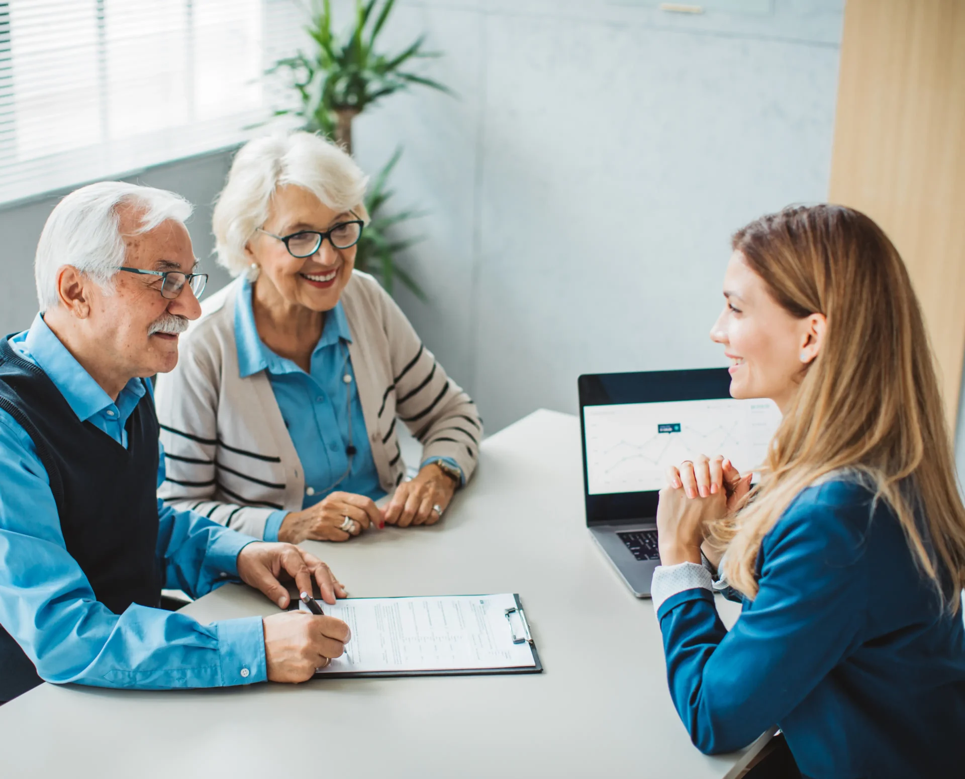 Advisor discussing finances with elderly clients